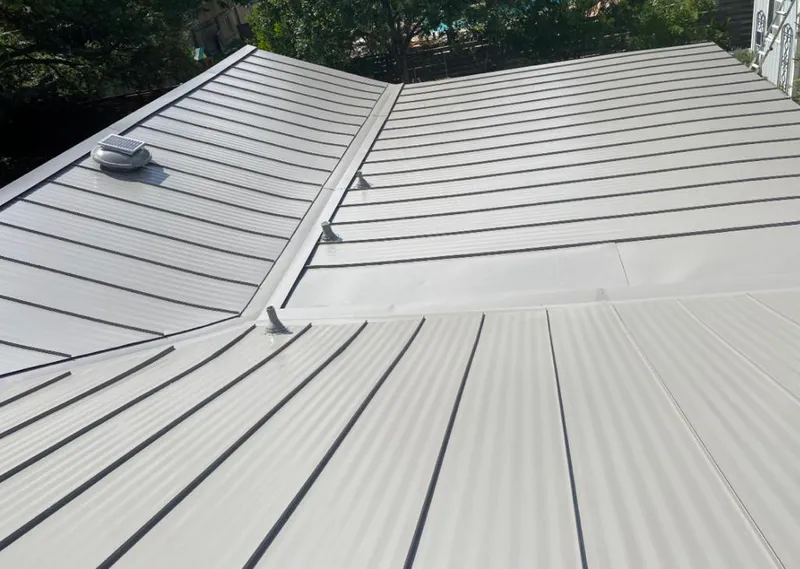 Solar attic fan installed on a metal roof for Roof Ventilation in Rib Mountain